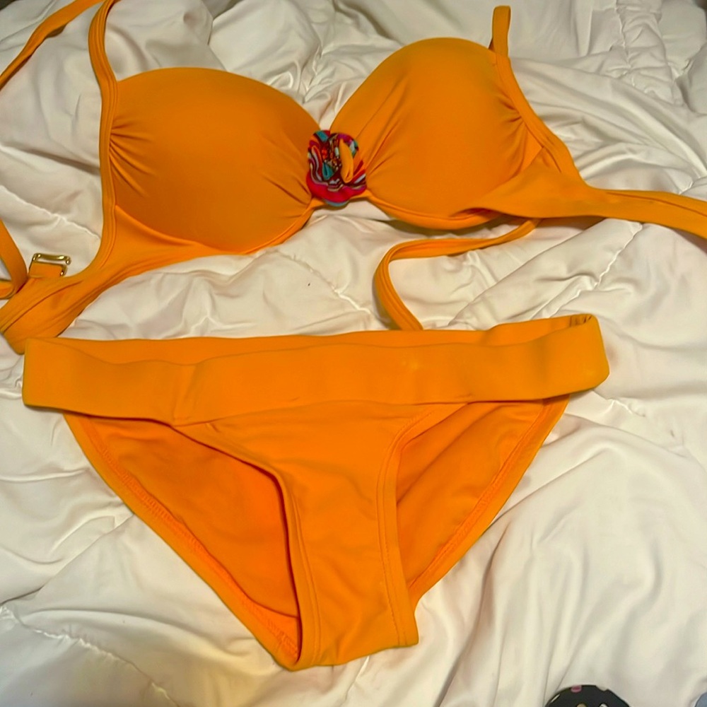 Orange bikini with flower in the middle of the top very good condition